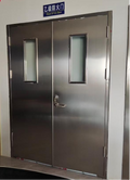 Stainless steel fire door double open with a window